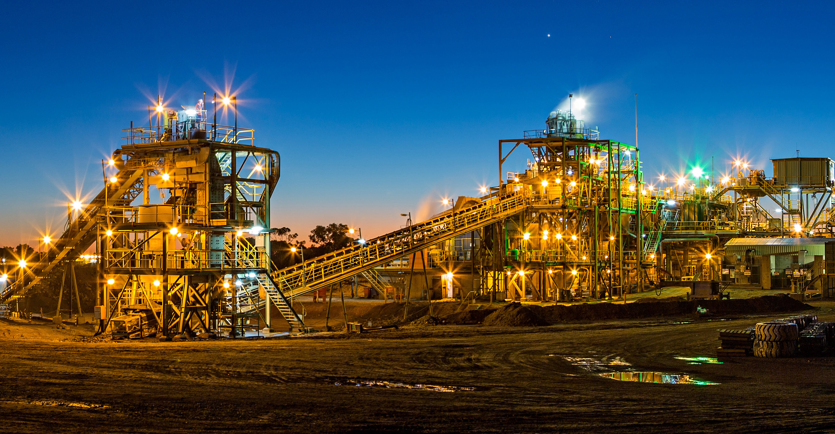 Image of a an oil, gas, and coal refinery, a hazardous and often explosive work environment.